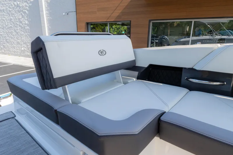 Slide: The Image of 2024 Cobalt R6 OB boat interior with luxurious seating and modern design. - 20
