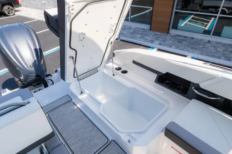 Slide: The Image of 2024 Cobalt R6 OB boat with open storage compartment and sleek design. - 22