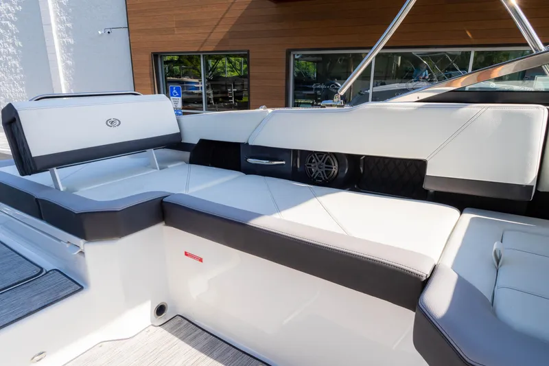 Slide: The Image of 2024 Cobalt R6 OB boat interior with sleek white and black seating. - 27