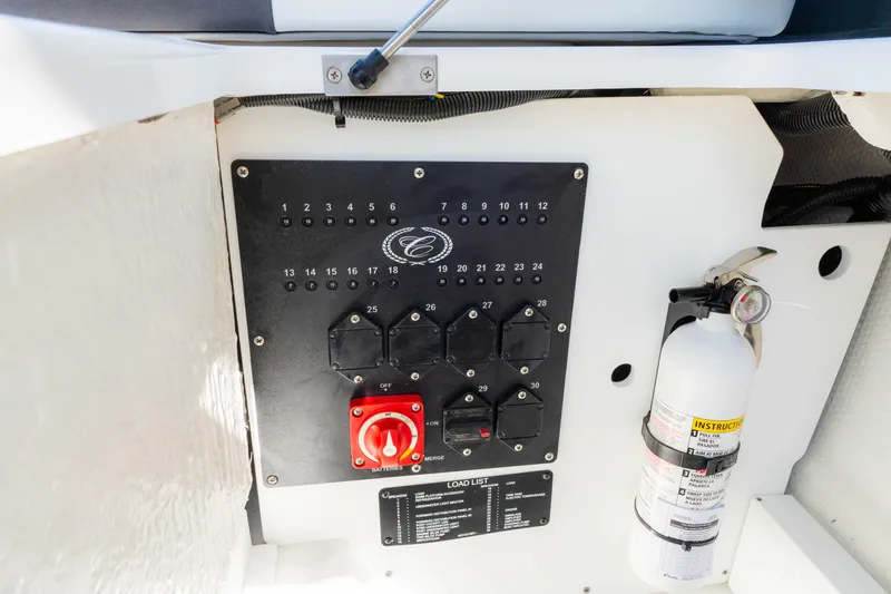 Slide: The Image of 2024 Cobalt R6 OB control panel with switches and fire extinguisher. - 29