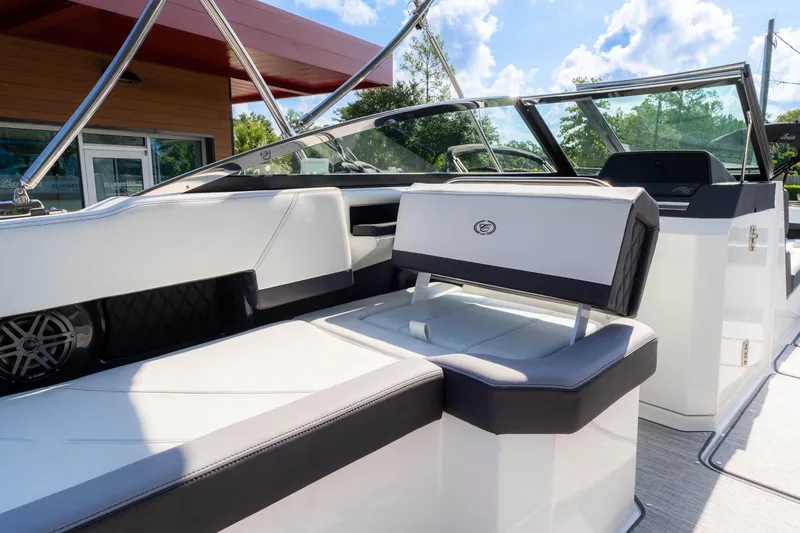 Slide: The Image of 2024 Cobalt R6 OB boat interior with sleek white seating and modern design. - 31