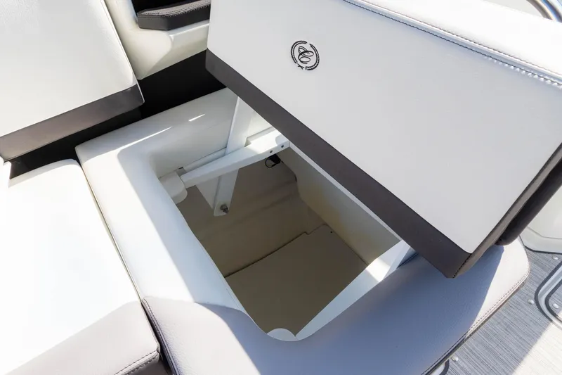Slide: The Image of 2024 Cobalt R6 OB boat seat storage compartment, open and spacious. - 32