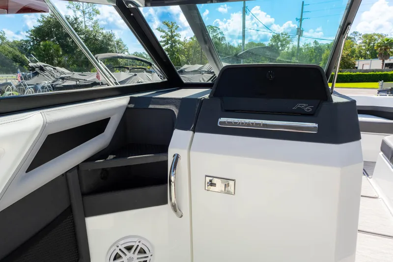 Slide: The Image of 2024 Cobalt R6 OB boat interior with sleek design and modern features. - 39