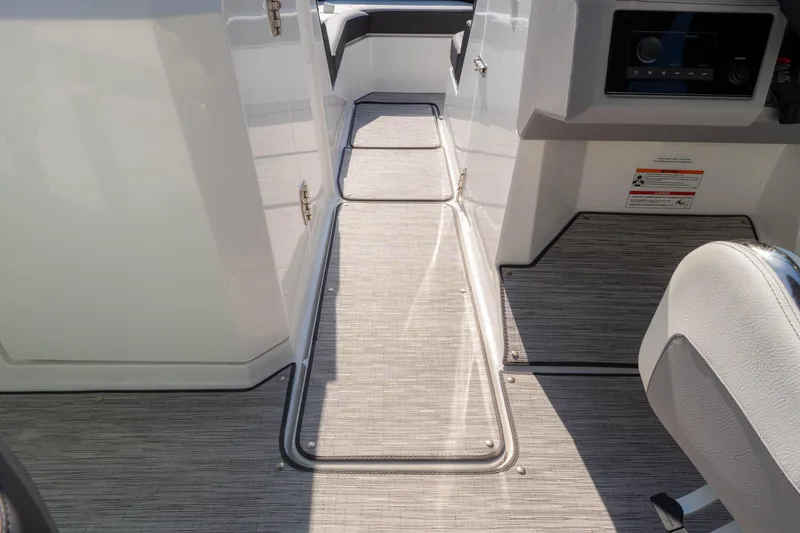 Slide: The Image of 2024 Cobalt R6 OB boat interior with sleek flooring and modern design. - 40