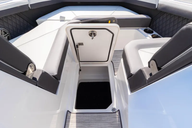 Slide: The Image of 2024 Cobalt R6 OB boat interior with open storage compartment and seating. - 44