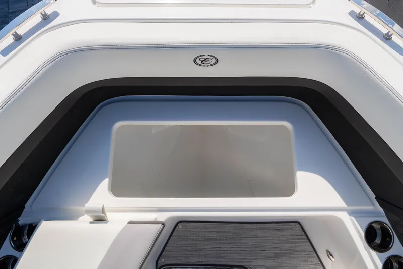 Slide: The Image of 2024 Cobalt R6 OB boat interior storage compartment, featuring sleek white and black design. - 47