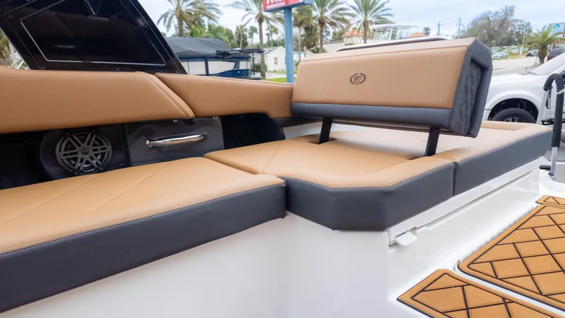 Slide: The Image of Luxurious seating on 2025 Cobalt R6OB boat with tan and gray upholstery. - 16