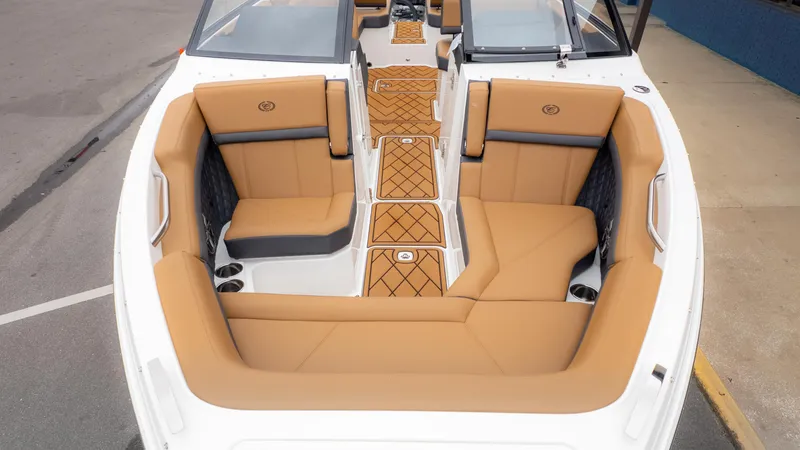 Slide: The Image of 2025 Cobalt R6OB boat interior with tan leather seating and stylish design. - 3