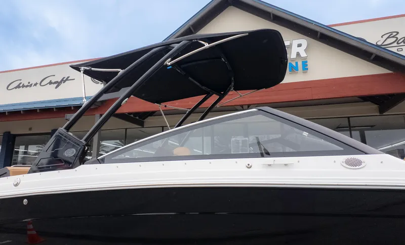 Slide: The Image of 2025 Cobalt R6OB boat displayed outside a marine store. - 41