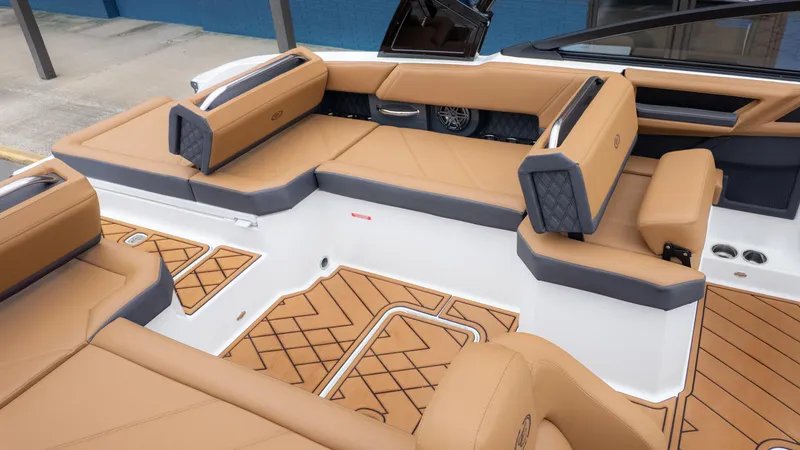Slide: The Image of 2025 Cobalt R6OB boat interior with tan and gray seating, featuring stylish design and spacious layout. - 8