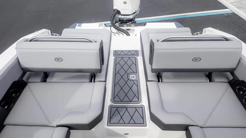 Slide: The Image of 2025 Cobalt R6OB boat interior with gray seating and sleek design. - 14