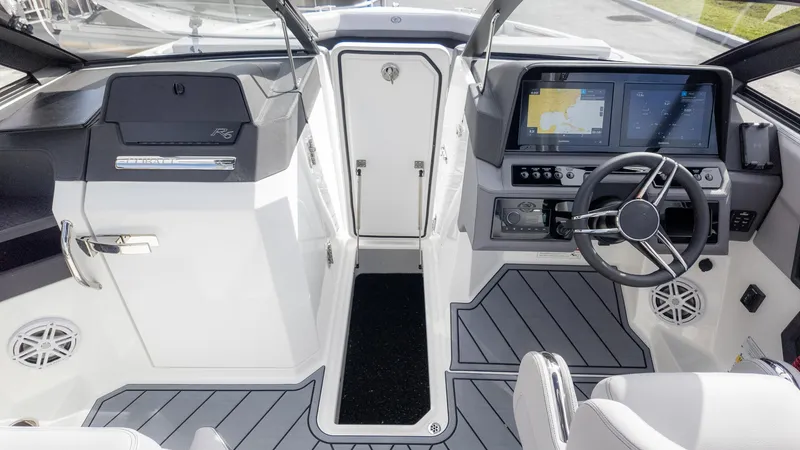 Slide: The Image of 2025 Cobalt R6OB boat cockpit with modern steering and navigation displays. - 24