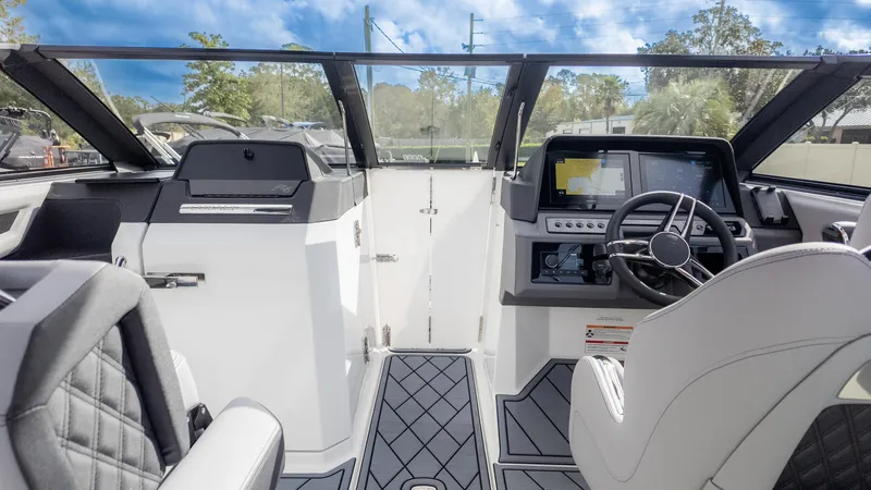 Slide: The Image of 2025 Cobalt R6OB boat interior with modern dashboard and steering wheel. - 25