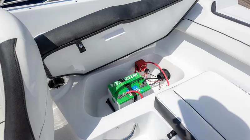 Slide: The Image of 2025 Stingray 172SC boat interior with battery compartment and seating. - 11