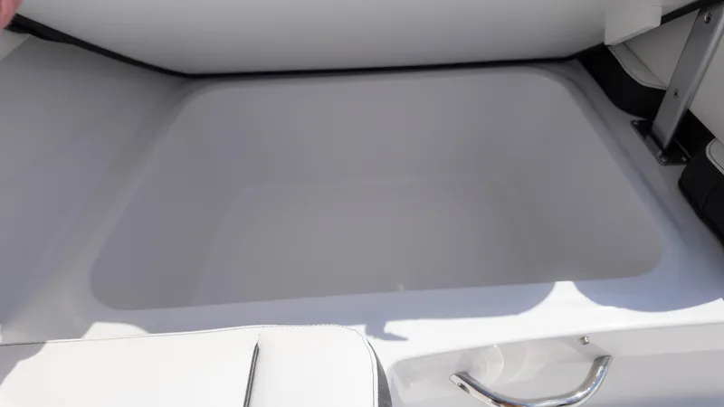 Slide: The Image of 2025 Stingray 172SC boat storage compartment, open and empty. - 13