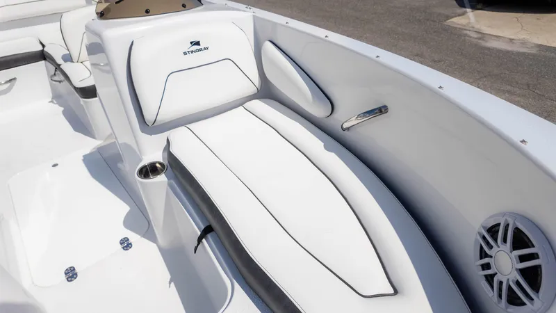 Slide: The Image of 2025 Stingray 172SC boat interior with white seating and speaker. - 16