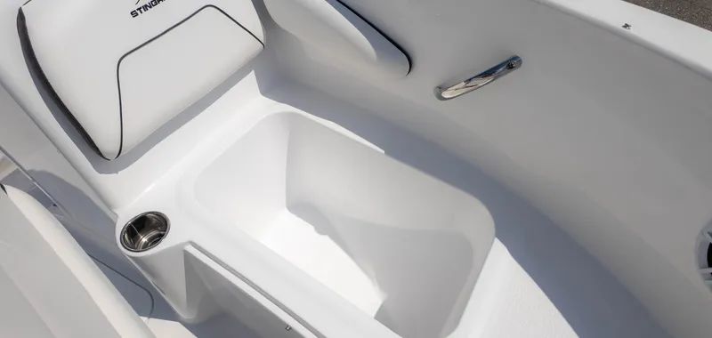Slide: The Image of 2025 Stingray 172SC boat interior with white seating and stainless steel cup holder. - 17