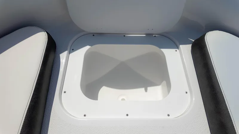 Slide: The Image of 2025 Stingray 172SC boat storage compartment with cushioned seating. - 18
