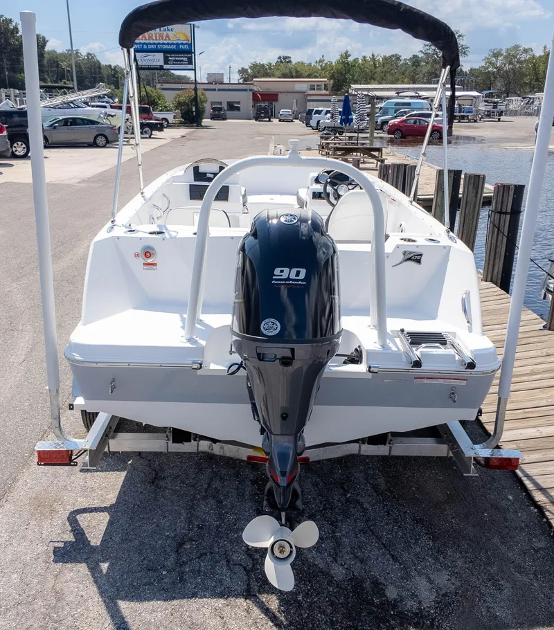 Slide: The Image of 2025 Stingray 172SC boat with 90HP outboard motor at marina dock. - 5