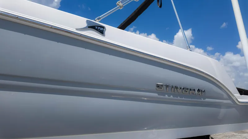 Slide: The Image of 2025 Stingray 172SC boat side view under blue sky. - 6