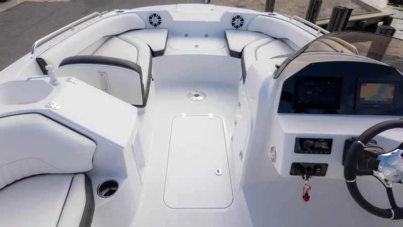 Slide: The Image of 2025 Stingray 192SC boat interior with modern dashboard and spacious seating. - 10