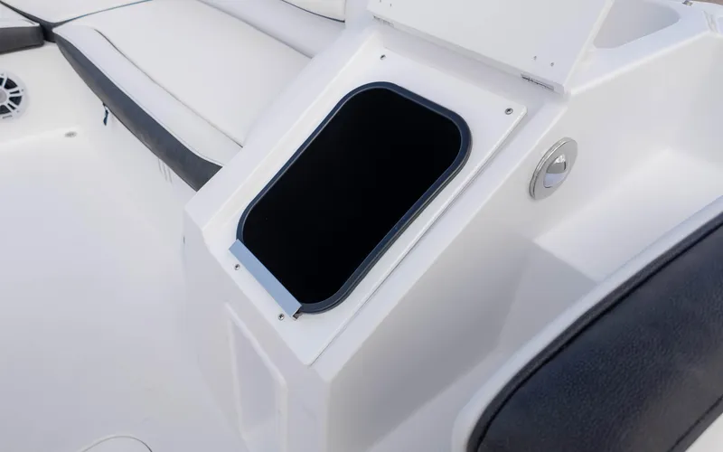 Slide: The Image of 2025 Stingray 192SC boat interior with open storage compartment and seating area. - 18