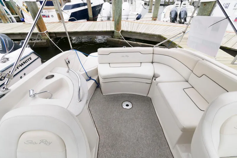 Slide: The Image of 2008 Sea Ray 260 Sundeck interior with white seating and deck view. - 5