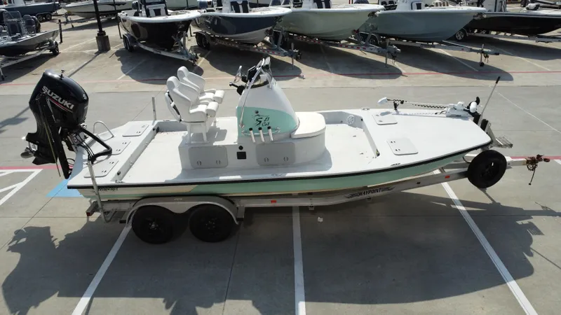 Slide: The Image of 2018 Shoalwater 21 CAT DLX boat on trailer, featuring Suzuki outboard motor. - 12