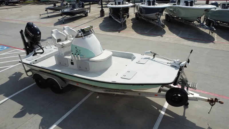 Slide: The Image of 2018 Shoalwater 21 CAT DLX boat on trailer in parking lot. - 13