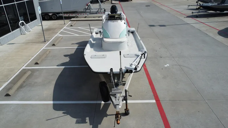 Slide: The Image of 2018 Shoalwater 21 CAT DLX boat on trailer in parking lot. - 14