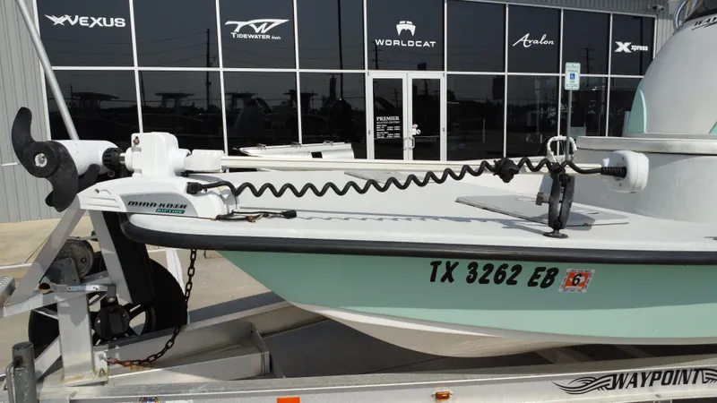 Slide: The Image of 2018 Shoalwater 21 CAT DLX boat on trailer, featuring Minn Kota trolling motor. - 20
