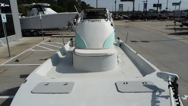 Slide: The Image of 2018 Shoalwater 21 CAT DLX boat in parking lot, front view. - 22