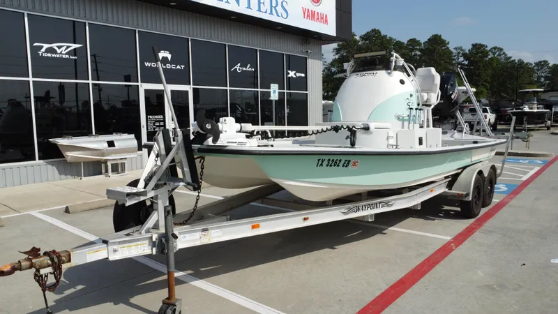 Slide: The Image of 2018 Shoalwater 21 CAT DLX boat on trailer outside dealership. - 5
