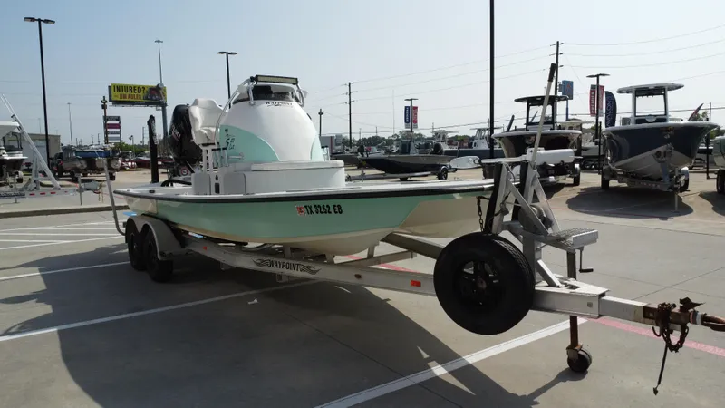 Slide: The Image of 2018 Shoalwater 21 CAT DLX boat on trailer in parking lot. - 7