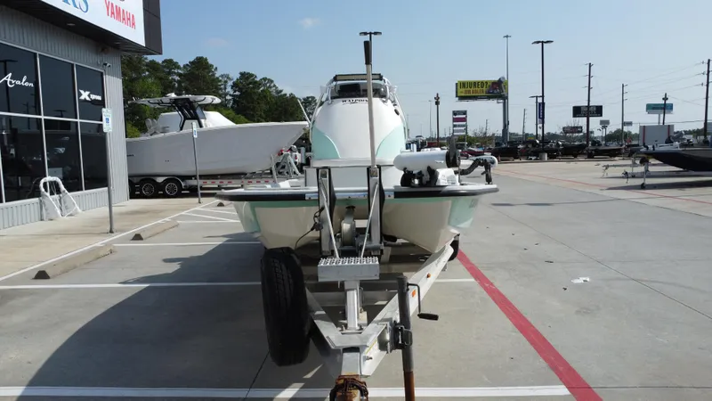 Slide: The Image of 2018 Shoalwater 21 CAT DLX boat on trailer in dealership parking lot. - 8