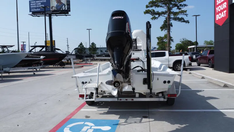 Slide: The Image of 2018 Shoalwater 21 CAT DLX boat on trailer in parking lot, rear view. - 9