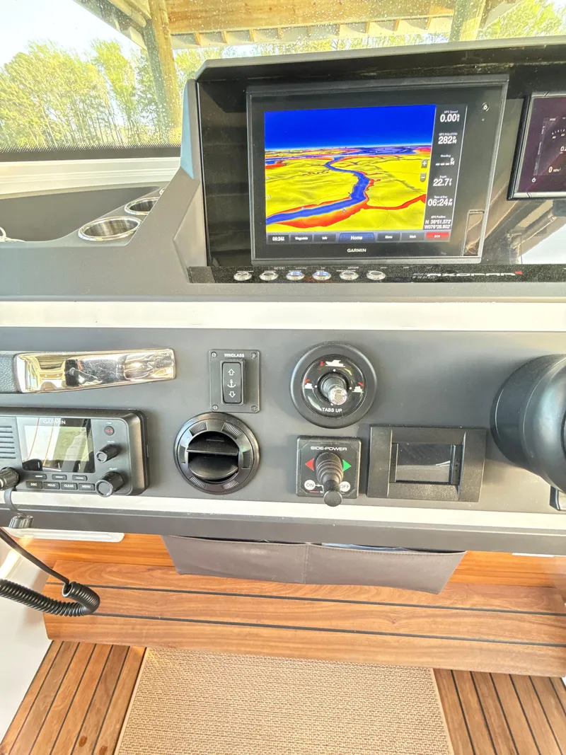 Slide: The Image of Control panel of 2019 Axopar 28 CABIN with navigation display and instruments. - 15
