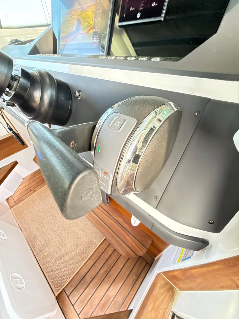 Slide: The Image of Control panel of 2019 Axopar 28 CABIN boat with modern navigation equipment. - 24