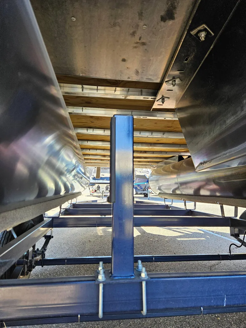 Slide: The Image of Underneath view of a 2018 Crest 200 CA pontoon boat on a trailer. - 7