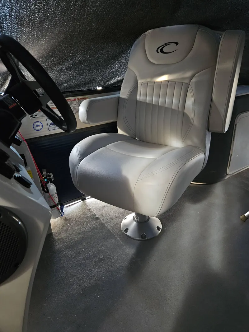 Slide: The Image of Captain's chair in 2018 Crest 200 CA boat interior, featuring plush upholstery and ergonomic design. - 9