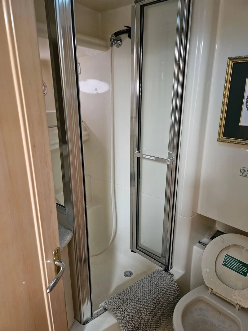 Slide: The Image of Bathroom in 1997 Carver 455 Aft Cabin Motoryacht with shower and toilet. - 14