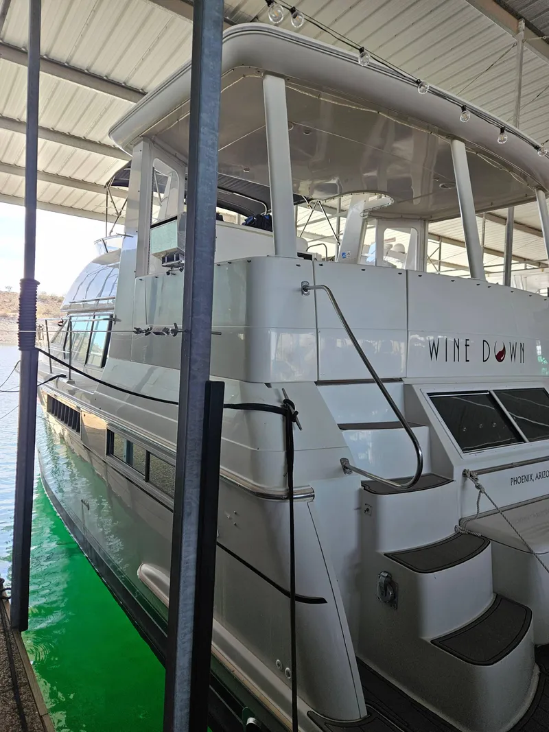 Slide: The Image of 1997 Carver 455 Aft Cabin Motoryacht docked under a covered marina. - 2