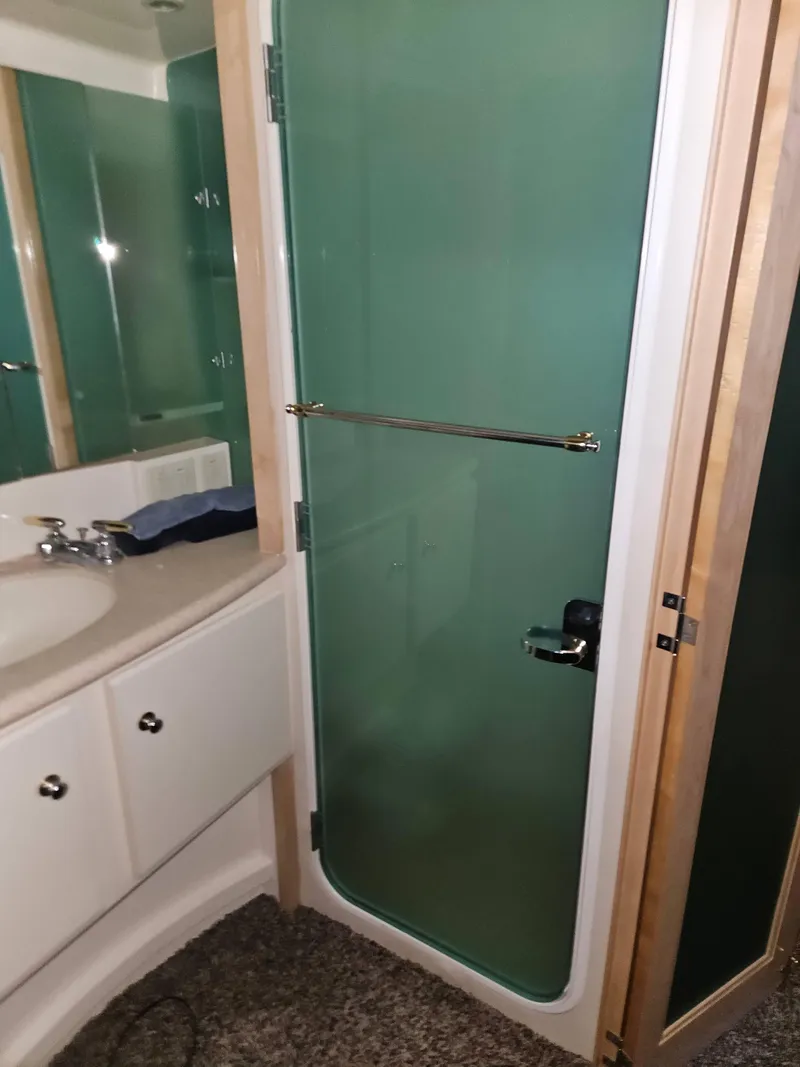 Slide: The Image of Bathroom interior of 1997 Carver 455 Aft Cabin Motoryacht with shower and sink. - 23