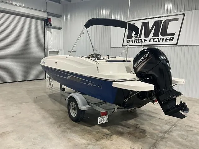 Slide: The Image of 2016 Bayliner 190 Deck Boat with Mercury engine on trailer in a marine center. - 3