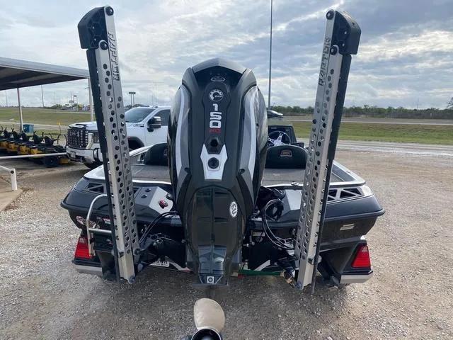 Slide: The Image of 2019 Ranger Z518 boat with powerful 150 engine, parked outdoors. - 10