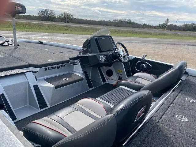 Slide: The Image of 2019 Ranger Z518 boat interior with dual seats and modern dashboard. - 12