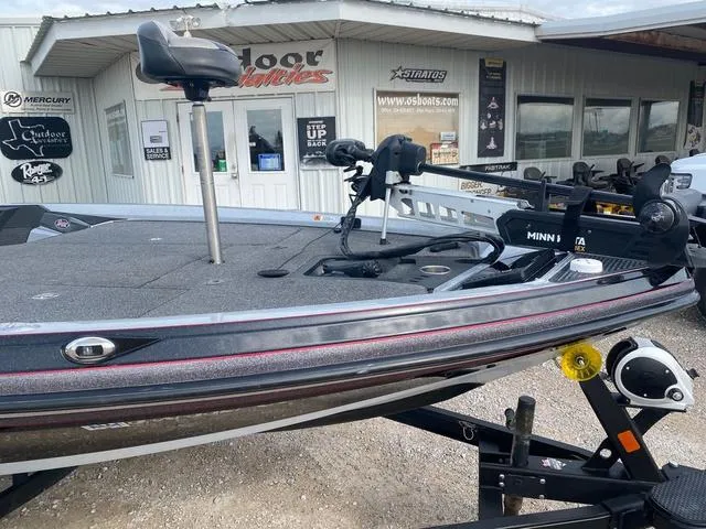 Slide: The Image of 2019 Ranger Z518 boat with Minn Kota trolling motor, parked outside a dealership. - 4