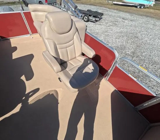Slide: The Image of 2015 Sweetwater SW 2286 SLC boat interior with beige captain's chair and red paneling. - 20