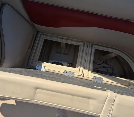 Slide: The Image of Open storage compartment in 2015 Sweetwater SW 2286 SLC boat seat. - 24