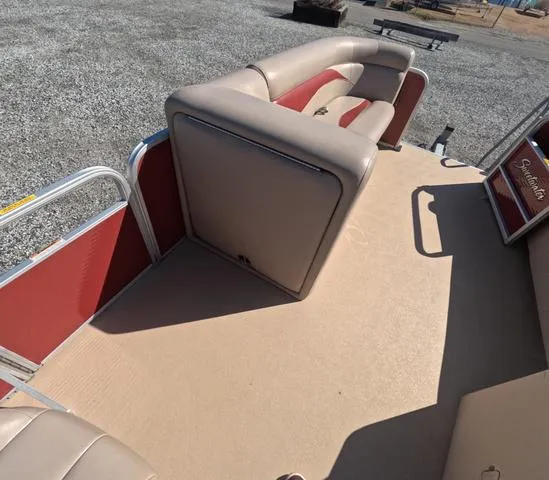Slide: The Image of 2015 Sweetwater SW 2286 SLC pontoon boat interior with beige and red seating. - 28